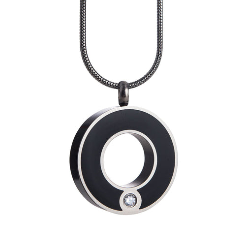 Circle of Life cremation necklace. An epoxy black circle and swarovski crystal.